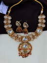 Majestic Triangle Kundan Necklace Set with Red & Green Drops